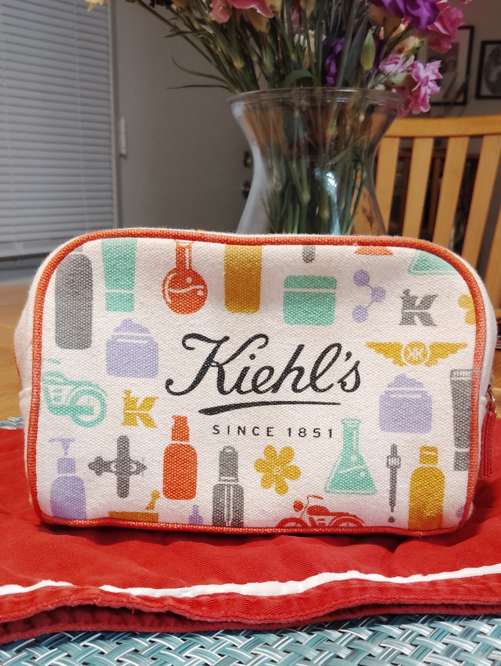 Kiehl's White Cosmetic Pouch with Orange Trim and Multi-Color Icons